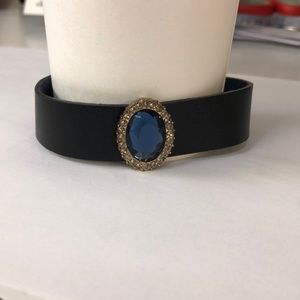 Black leather cuff bracelet with faux jewel